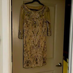 NWT knee length long sleeved gown. This is gorgeous and elegant.